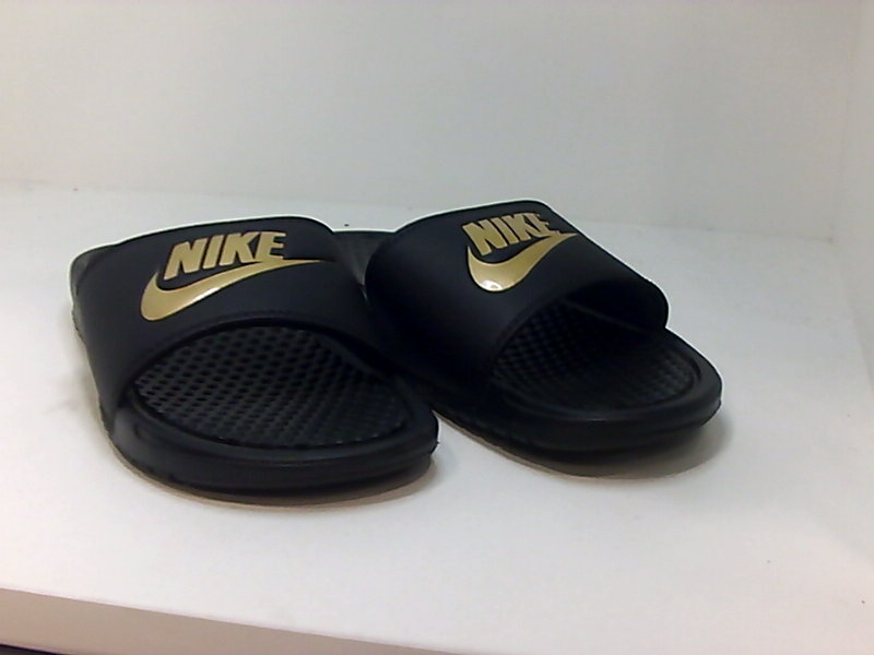 black and gold nike flip flops